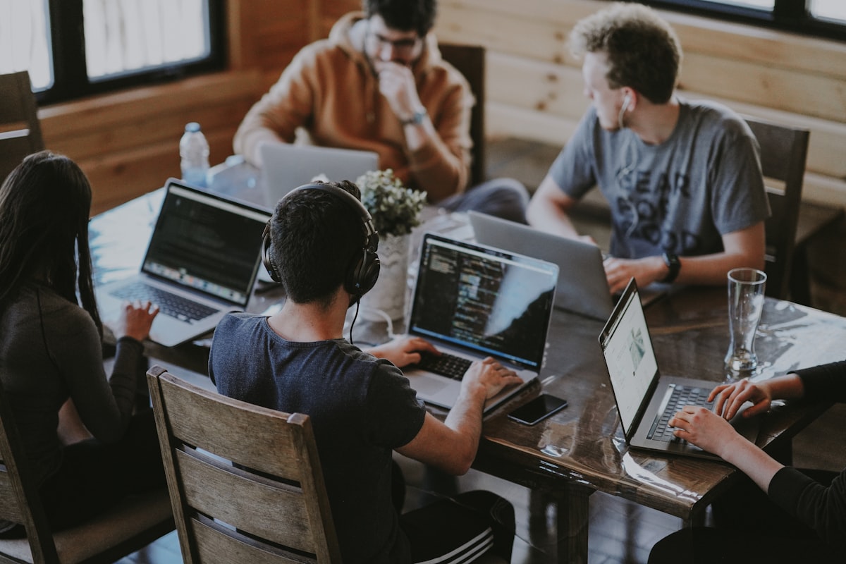 Operators and engineers collaborating hands-on to build custom AI agents